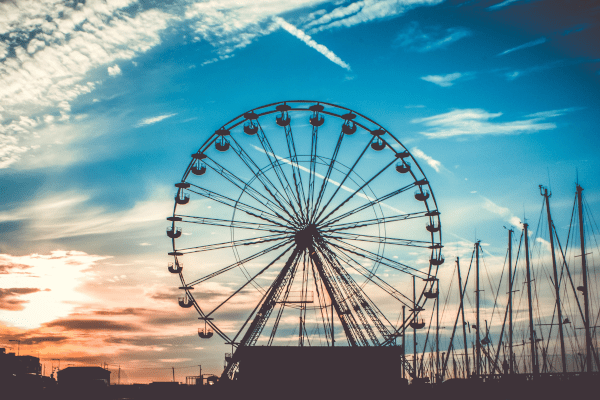 Big Wheel Ride In front of cloudy blue Sunset