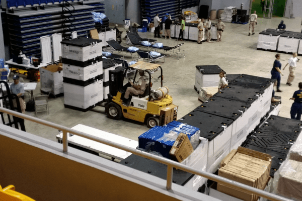 Inside a factory warehouse where forklifts are being used to move products about.